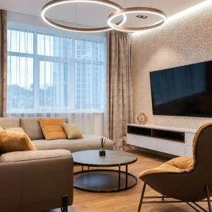 pexels-photo-6186821-6186821 Cozy living room with contemporary furnishings, stylish decor, and a large TV, ideal for relaxation.